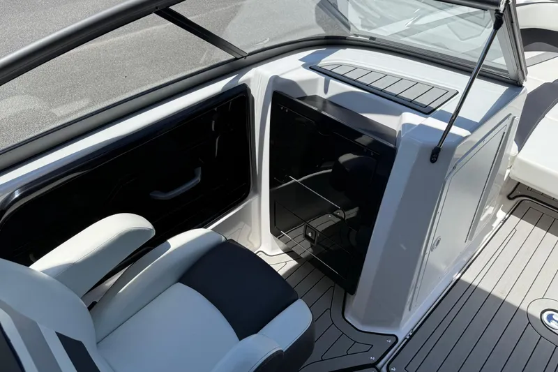 Slide: The Image of 2020 Yamaha Boats 212S interior with seating and storage, featuring sleek design and modern amenities. - 15