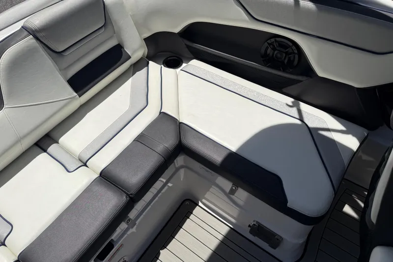 Slide: The Image of 2020 Yamaha Boats 212S interior seating with sleek design and integrated speaker. - 22