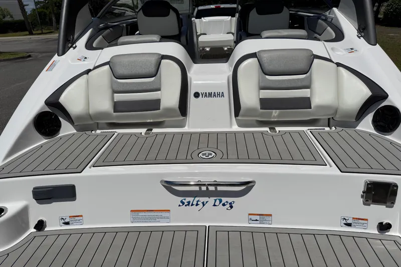 Slide: The Image of 2020 Yamaha Boats 212S with "Salty Dog" decal, featuring sleek seating and deck design. - 25