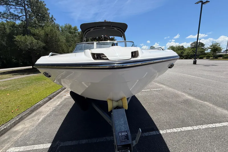 Slide: The Image of 2020 Yamaha Boats 212S in a parking lot, showcasing sleek design and modern features. - 9