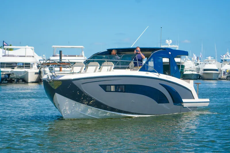 The Image of Modern Hanover 387 yacht cruising in a marina, 2027 model, with clear blue skies. - 0