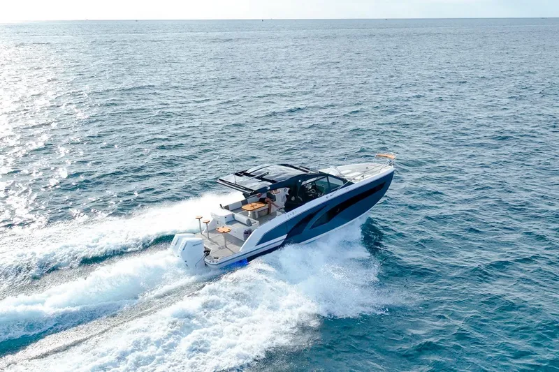 Slide: The Image of A sleek 2027 Hanover 387 yacht cruising on open blue waters. - 1