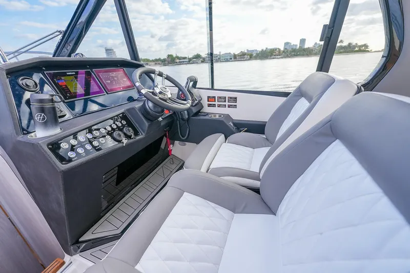 Slide: The Image of Interior of 2027 Hanover 387 boat with modern dashboard and comfortable seating. - 15
