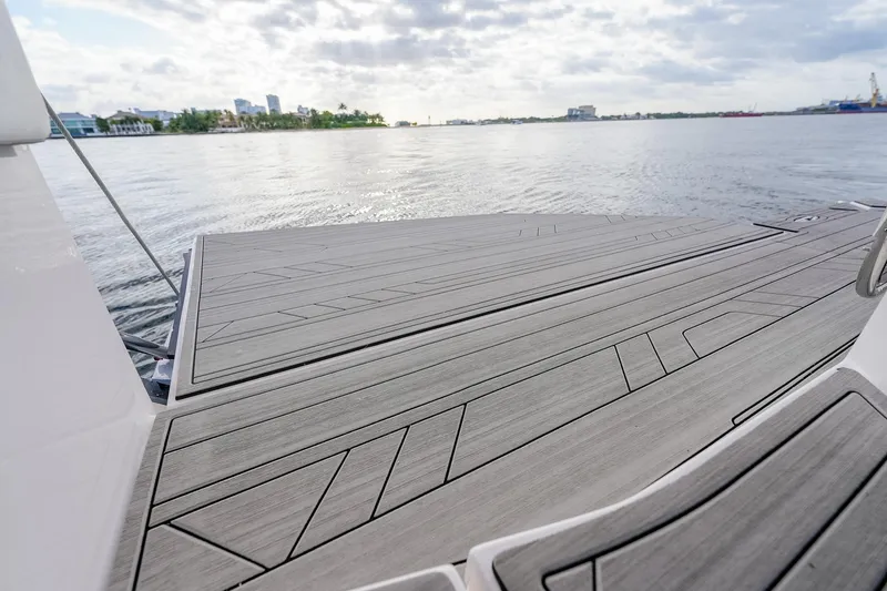 Slide: The Image of Modern Hanover 387 yacht deck overlooking serene waterfront, 2027 model. - 20