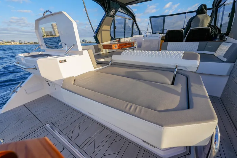 Slide: The Image of Luxurious 2027 Hanover 387 yacht interior with plush seating and ocean view. - 21