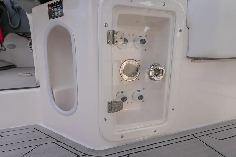Slide: The Image of Control panel of a 2027 Hanover 387 boat, featuring gauges and switches. - 24