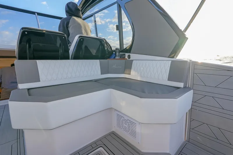 Slide: The Image of Luxurious seating on a 2027 Hanover 387 boat, featuring modern design and ocean view. - 27