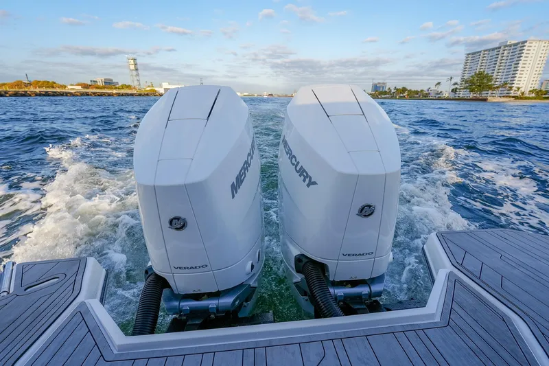 Slide: The Image of Twin Mercury Verado engines powering a Hanover 387 boat, cruising on open water, 2027 model. - 30