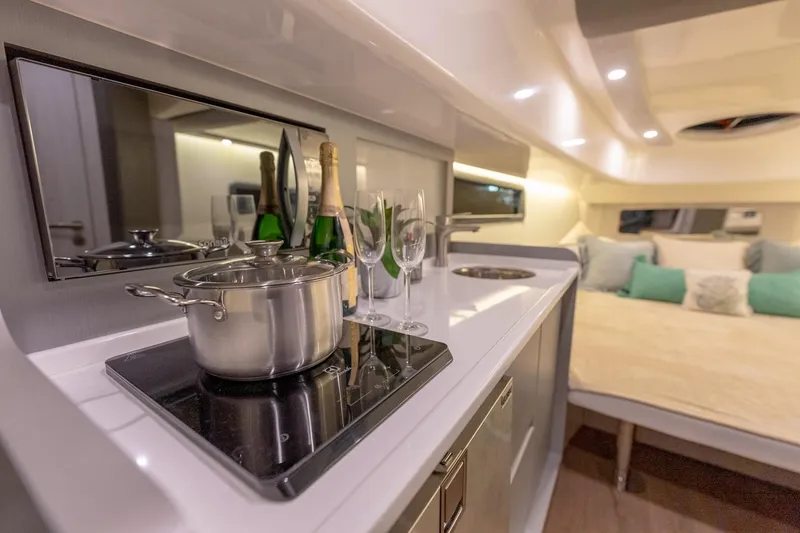 Slide: The Image of Luxurious Hanover 387 yacht interior with modern kitchen and cozy sleeping area, 2027 model. - 37