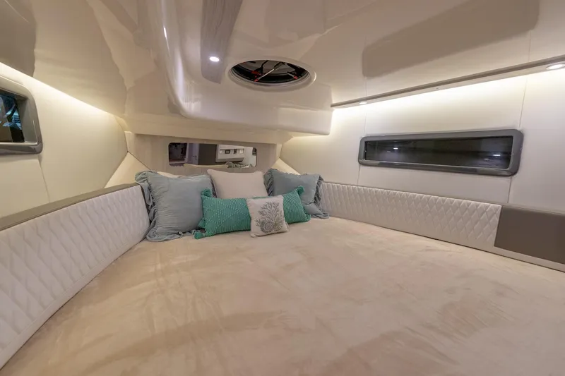 Slide: The Image of Luxurious interior cabin of 2027 Hanover 387 yacht with plush bedding and ambient lighting. - 38