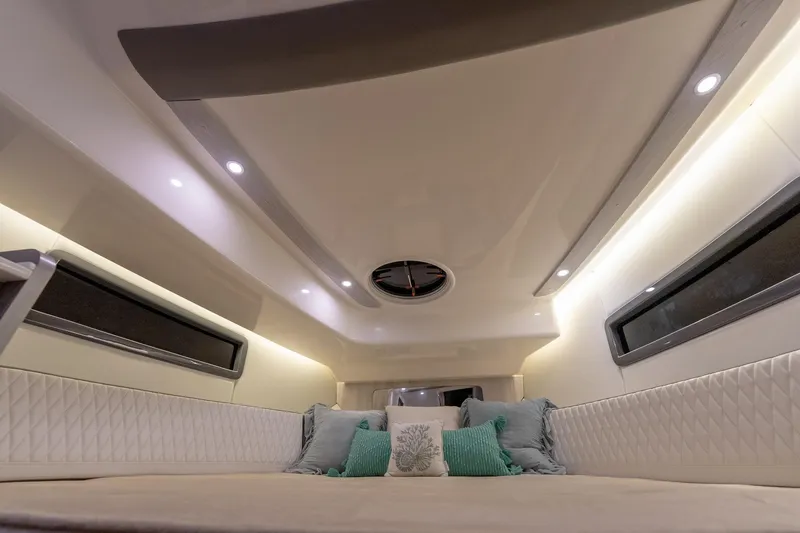 Slide: The Image of Luxurious interior of 2027 Hanover 387 yacht with elegant lighting and plush seating. - 39