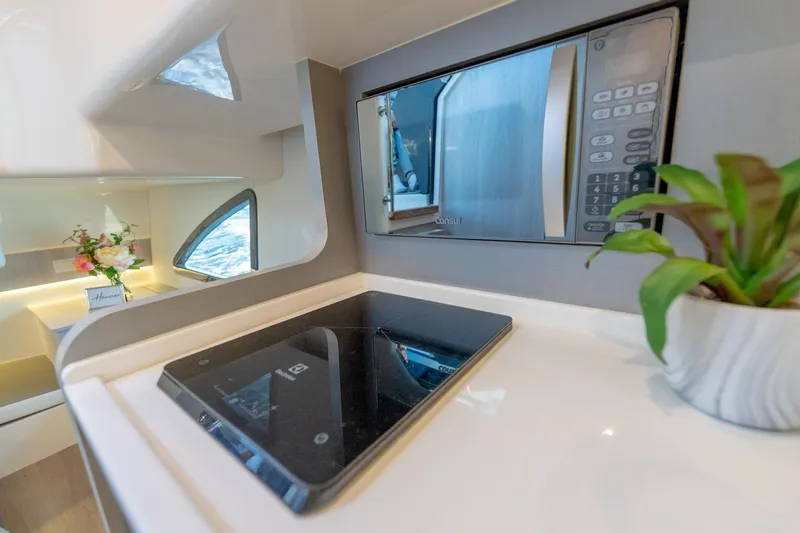 Slide: The Image of Modern kitchen in 2027 Hanover 387 yacht with microwave and induction cooktop. - 44