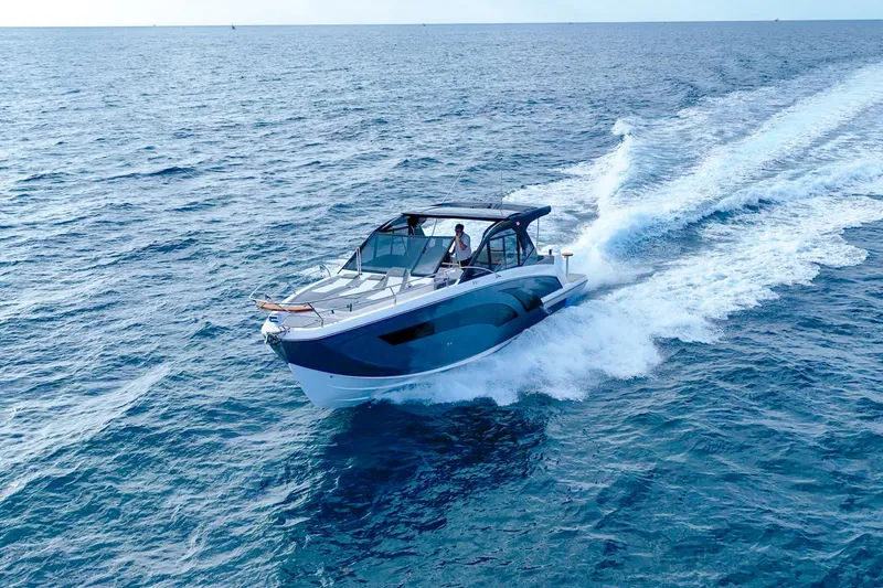 Slide: The Image of Modern Hanover 387 boat cruising on open sea, 2027 model. - 5