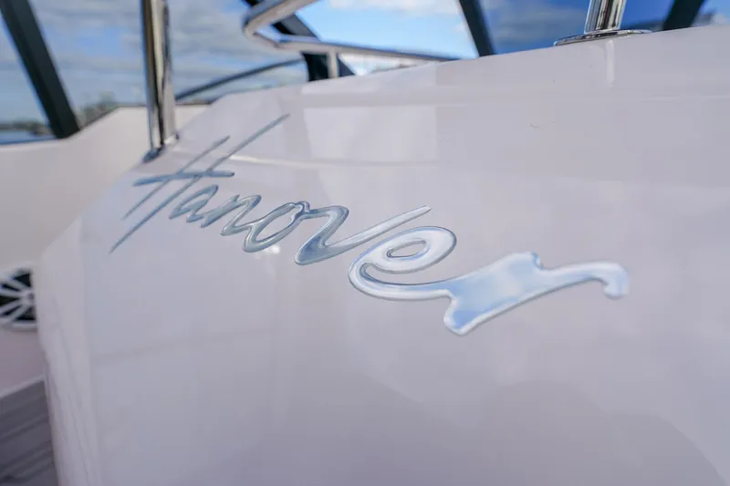 Slide: The Image of Close-up of 2027 Hanover 387 boat logo with sleek metallic finish. - 50