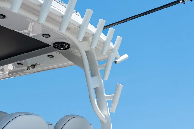 Slide: The Image of Close-up of 2026 Twin Vee 400 GFX2 CC boat's rod holders against a clear blue sky. - 10