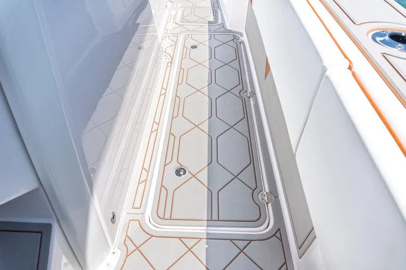 Slide: The Image of 2026 Twin Vee 400 GFX2 CC boat deck with modern geometric design and sleek finish. - 15