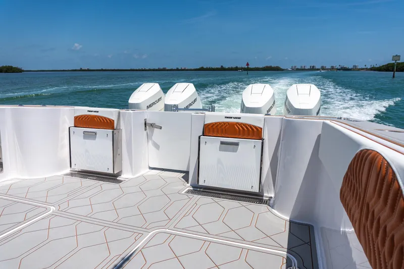 Slide: The Image of Twin Vee 400 GFX2 CC 2026 boat with Mercury engines cruising on open water. - 28