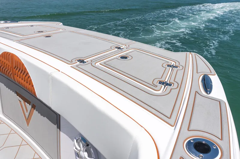 Slide: The Image of 2026 Twin Vee 400 GFX2 CC boat deck with sleek design on open water. - 35