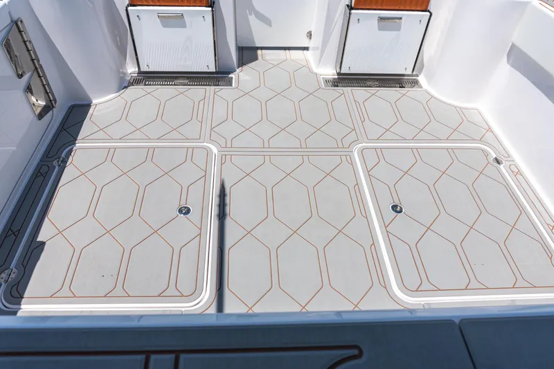 Slide: The Image of Deck of 2026 Twin Vee 400 GFX2 CC boat with geometric pattern flooring. - 36