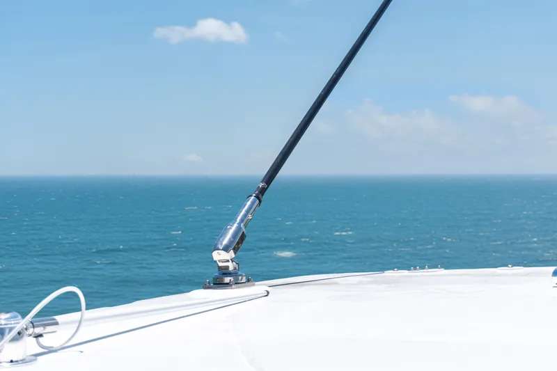 Slide: The Image of Bow of 2026 Twin Vee 400 GFX2 CC boat with ocean view and clear sky. - 37