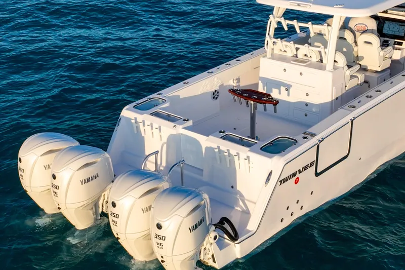 Slide: The Image of 2026 Twin Vee 400 GFX2 CC boat with four Yamaha 350 V6 engines on open water. - 45