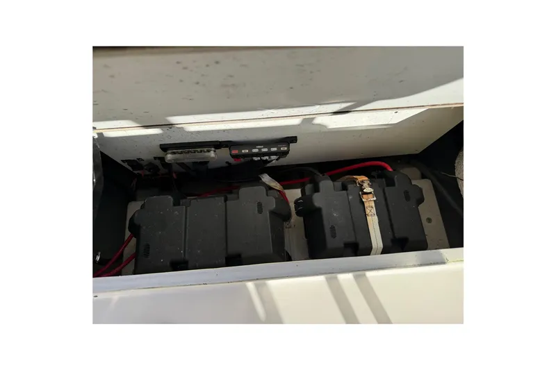 Slide: The Image of Battery compartment of a 2018 Cobia 220 Center Console boat with wiring. - 21