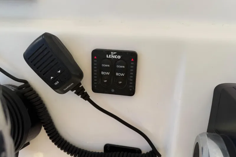 Slide: The Image of Control panel and microphone on 2018 Cobia 220 Center Console boat. - 27