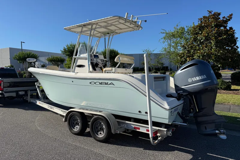 Slide: The Image of 2018 Cobia 220 Center Console boat on trailer with Yamaha outboard motor. - 3