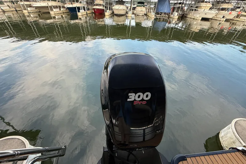 Slide: The Image of 2016 Starcraft MX 25 DL with 300 Pro outboard motor at marina. - 7