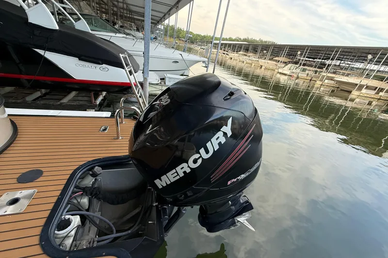 Slide: The Image of 2016 Starcraft MX 25 DL boat with Mercury outboard motor docked at marina. - 8