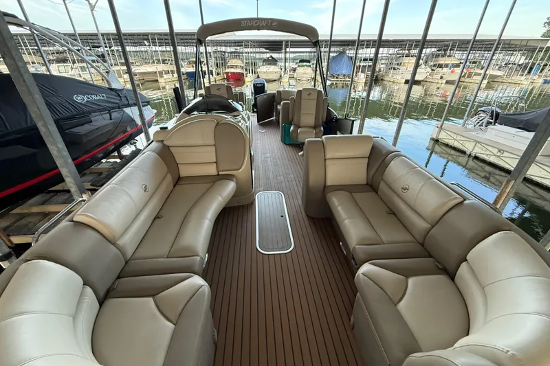 Slide: The Image of Luxurious 2016 Starcraft MX 25 DL pontoon boat with spacious seating at marina. - 9