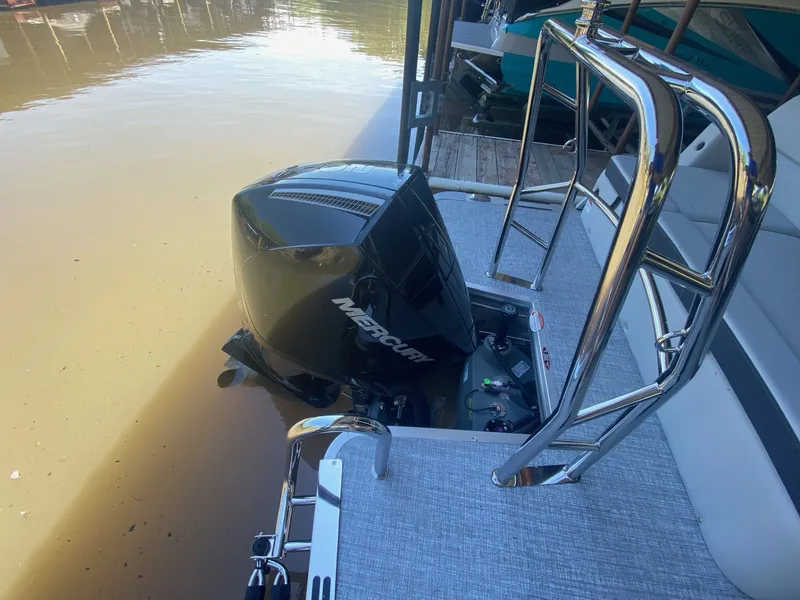 Slide: The Image of Harris 250CX 2024 with Mercury outboard motor at dock. - 18