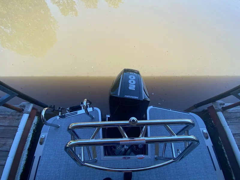 Slide: The Image of Harris 250CX 2024 with Mercury 200 engine on water. - 19