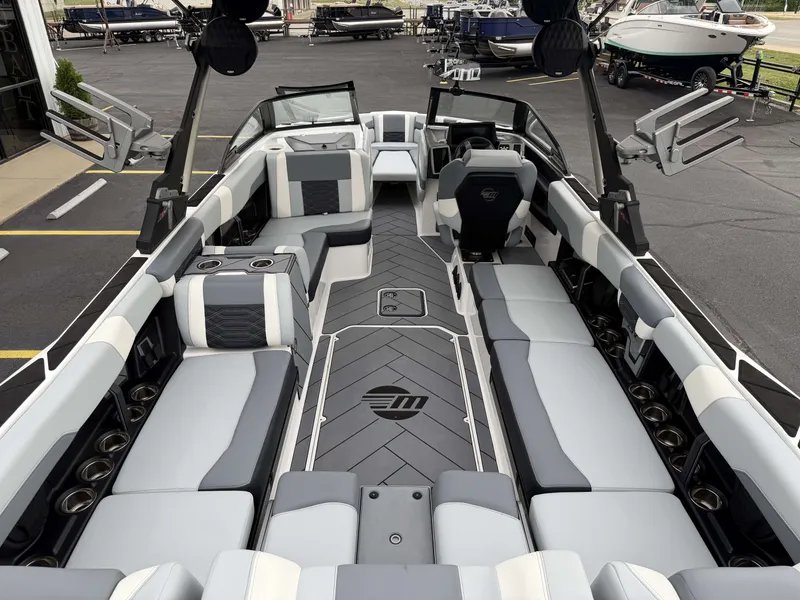 Slide: The Image of Interior of a 2023 Malibu 26LSV boat with luxurious seating. - 11