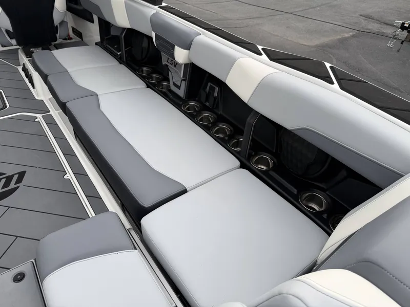 Slide: The Image of Interior of 2023 Malibu 26LSV with gray seating and cup holders. - 13
