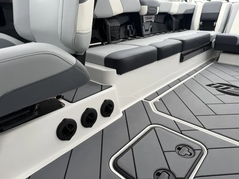 Slide: The Image of Interior of 2023 Malibu 26LSV with gray seating and flooring. - 24