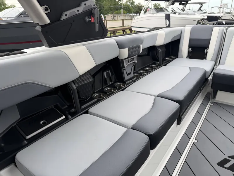 Slide: The Image of Interior of 2023 Malibu 26LSV with gray upholstery and cup holders. - 25