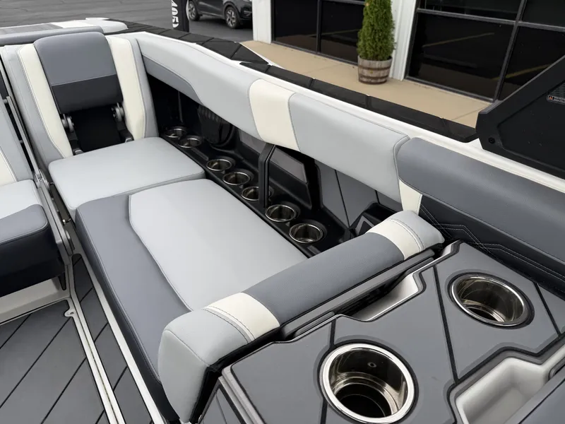 Slide: The Image of Interior of 2023 Malibu 26LSV with gray upholstery and cup holders. - 26