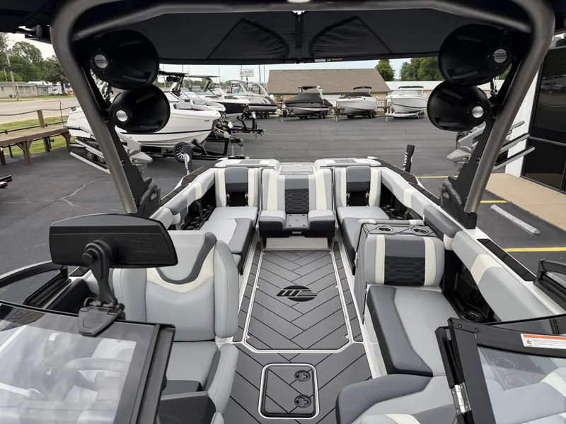 Slide: The Image of Interior of a 2023 Malibu 26LSV boat with luxurious seating. - 32
