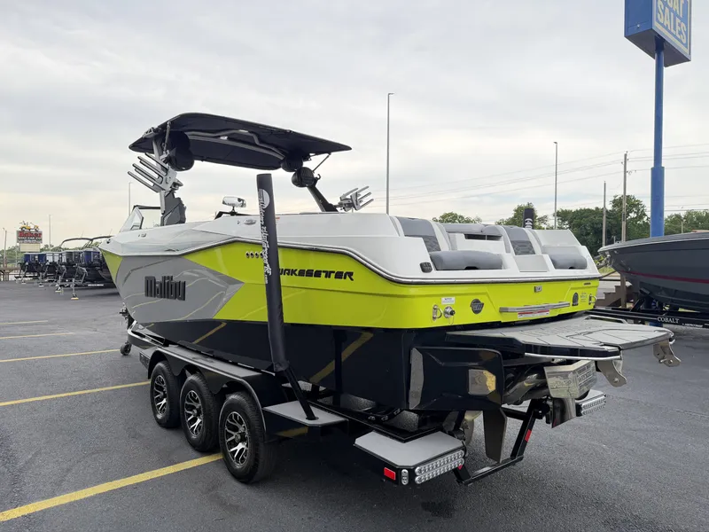 Slide: The Image of 2023 Malibu 26LSV Wakesetter boat on trailer outdoors. - 6