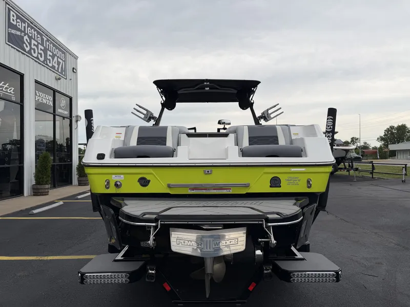 Slide: The Image of Rear view of a 2023 Malibu 26LSV boat in a parking lot. - 7