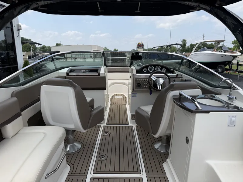 Slide: The Image of Interior of a 2013 Sea Ray 250SLX with sleek design features. - 11