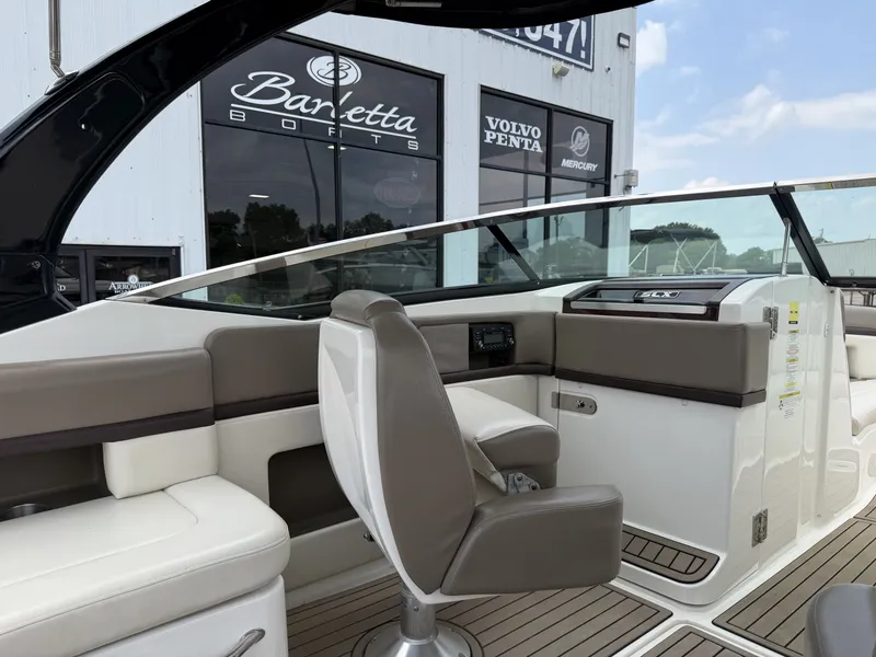 Slide: The Image of Interior of a 2013 Sea Ray 250SLX with sleek seating. - 13