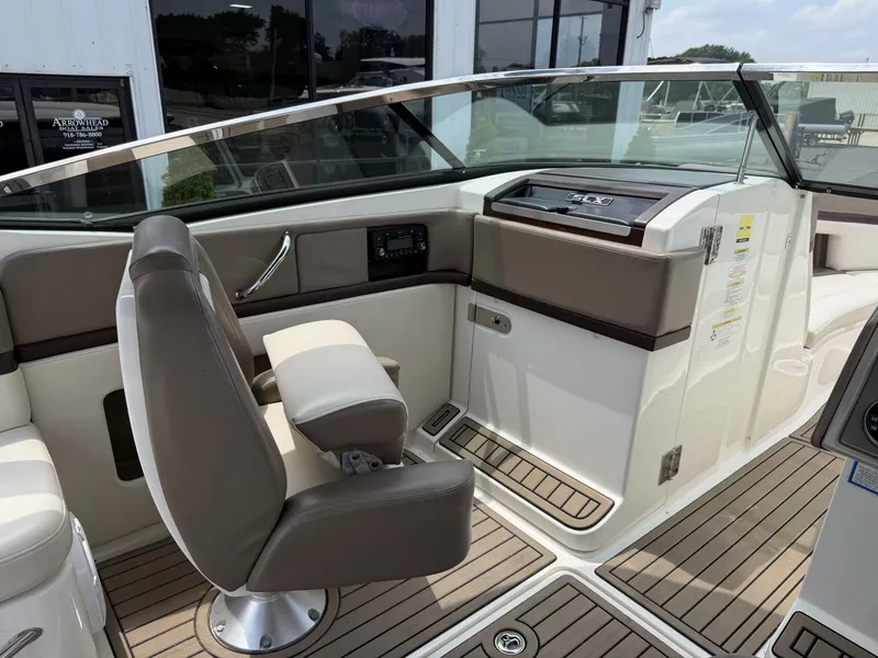 Slide: The Image of Interior of a 2013 Sea Ray 250SLX boat with helm station. - 16