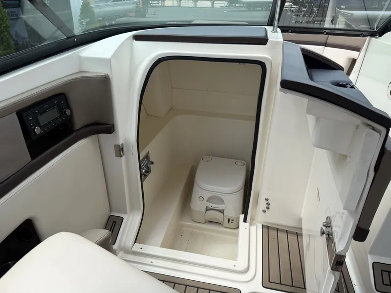 Slide: The Image of Interior of a 2013 Sea Ray 250SLX featuring a toilet. - 17