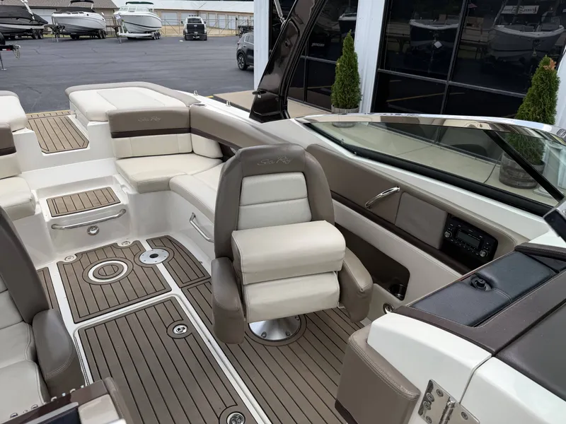 Slide: The Image of Interior of a 2013 Sea Ray 250SLX with luxurious seating. - 21