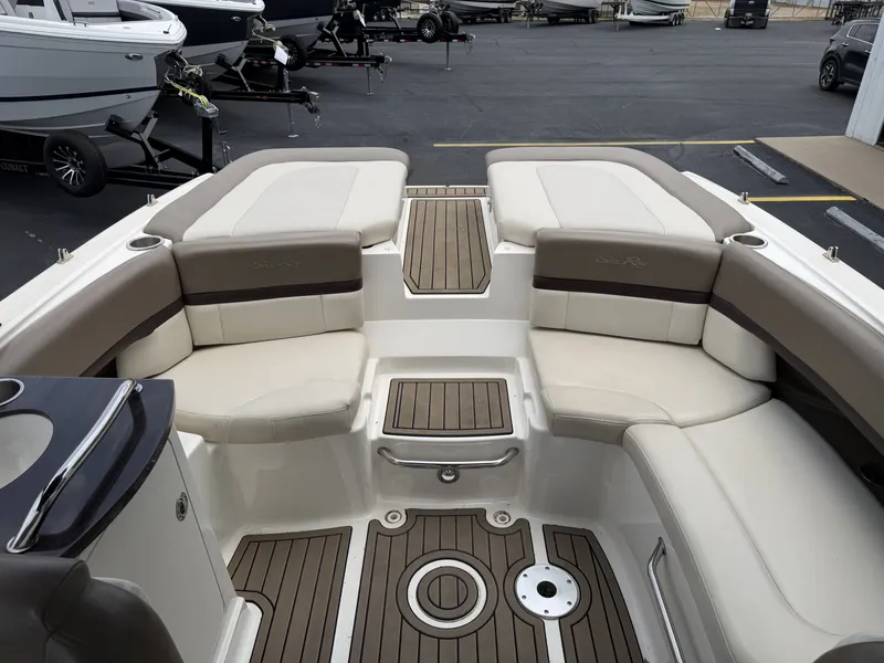Slide: The Image of Interior of a 2013 Sea Ray 250SLX with beige seating. - 22