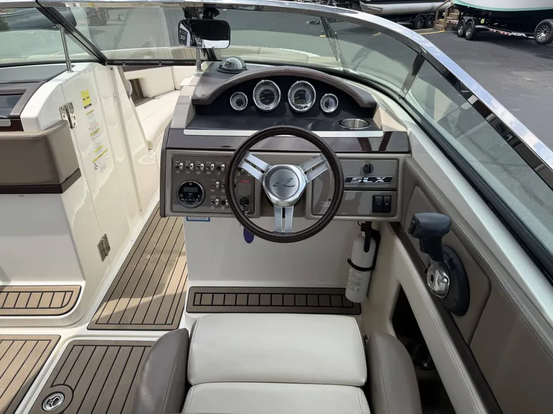 Slide: The Image of Interior view of 2013 Sea Ray 250SLX boat cockpit. - 26
