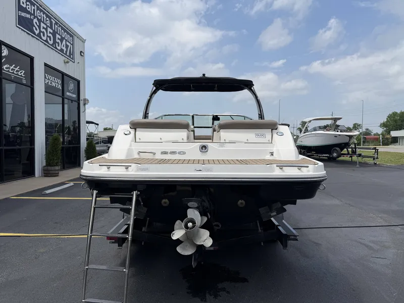 Slide: The Image of Rear view of a 2013 Sea Ray 250SLX boat on a trailer. - 5