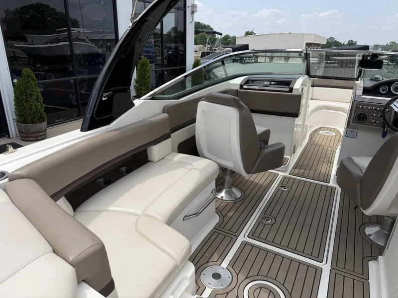 Slide: The Image of Interior of a 2013 Sea Ray 250SLX with luxurious seating area. - 9